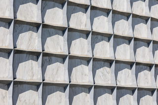 Exterior of the Beinecke Library features powerful stone geometry and marble panes