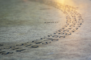 Detail of numbers carved into Maya Lin's Women's Table sculpture