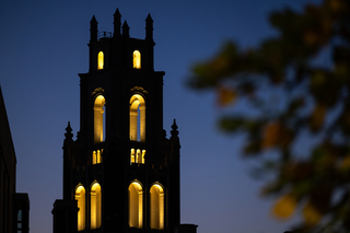 Bass tower at night with glowing yellow windows